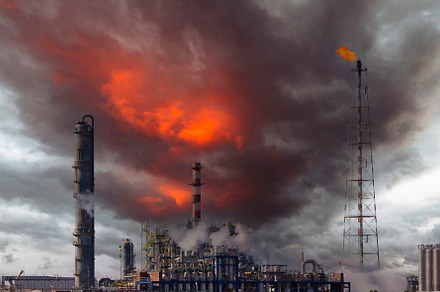 Fire from a gas torch and smoke stacks