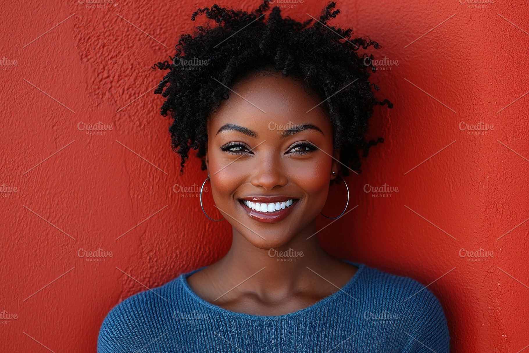 Confident woman in blue turtleneck sweater smiling in front of vibrant red wall, a Person Photo by José Manuel Gelpi