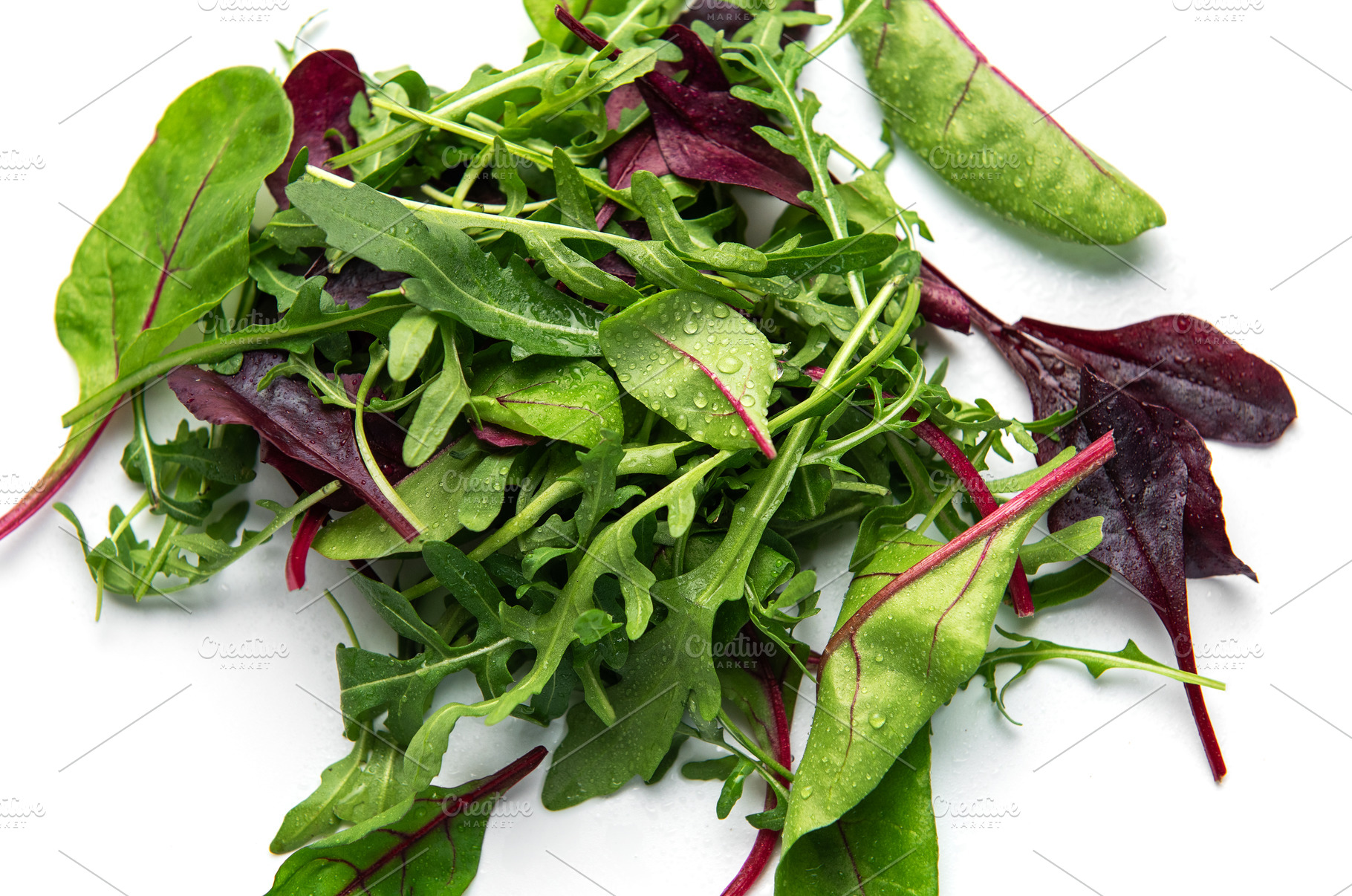 Fresh mixed salad greens creating a healthy background, a Photo by Olena Rudo