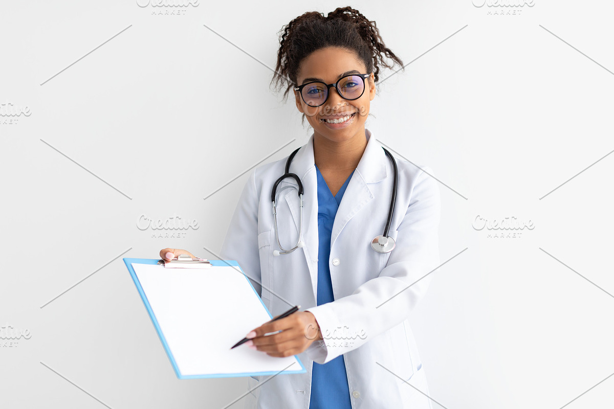 Portrait of black doctor looking at camera showing clipboard, a Photo by Prostock-Studio (Photo 3 of 3)