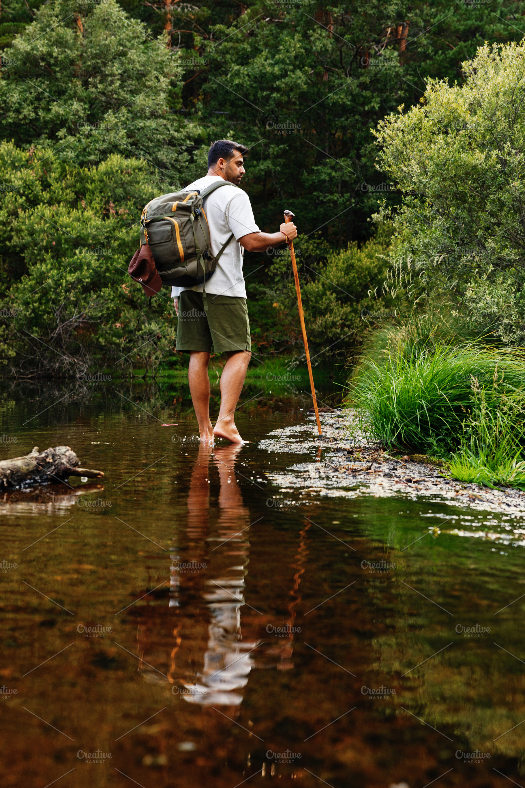 Adventurer crossing barefoot stream, a Sports & Recreation Photo by Perpis