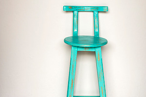 Blue Wooden Stool Against Wall, a Photo by THP Creative