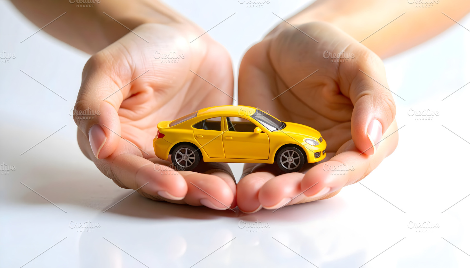 Yellow Toy Car Protected in Human Ha, a Business Photo by Stock Shape