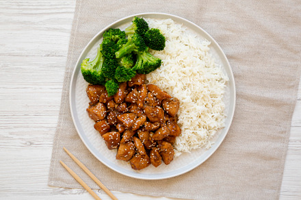 Homemade Teriyaki Chicken with Rice and Broccoli on a plate on a, a Food & Drink Photo by LiudmylaChuhunova