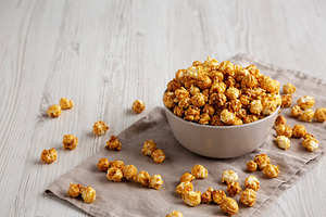 Homemade Caramel Popcorn in a Bowl, side view. Copy space., a Food & Drink Photo by LiudmylaChuhunova
