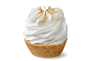 Sweet tartlet with meringue on a
