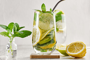 Summer drink with lime and mint. Cold drink, non-alcoholic mojit, a Food & Drink Photo by ndanko
