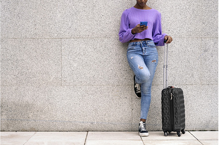 Faceless Tourist Woman Using Phone