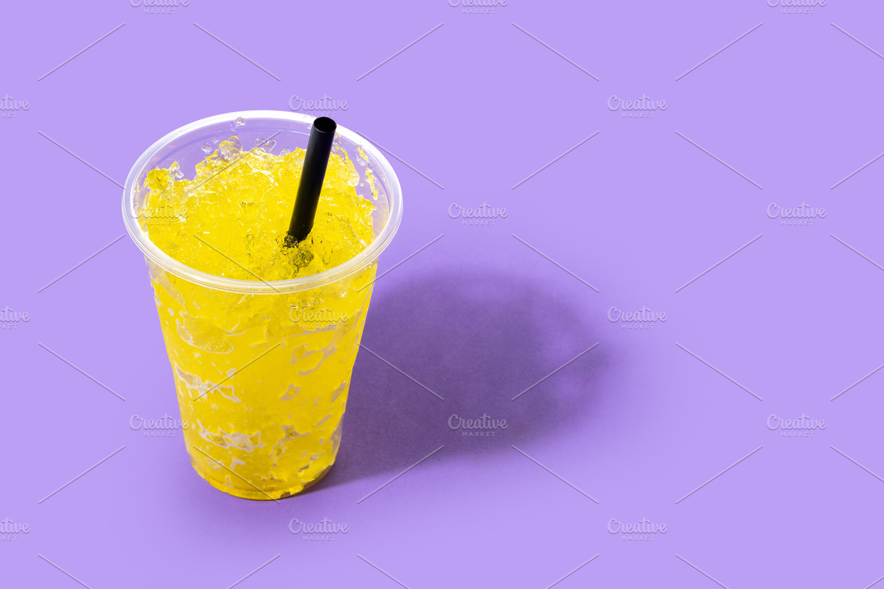 Yellow Slush Drink in Plastic Cup with Black Straw, a Food & Drink Photo by etorres69