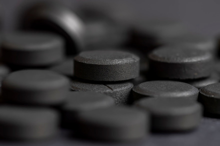 Open and unpacked tablets of black color close-up, a Background Photo by MyPhotos