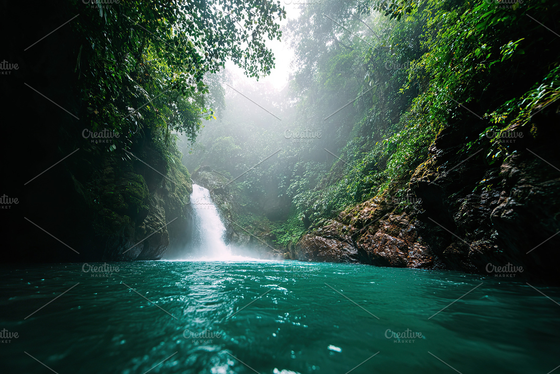 Waterfall cascades into serene turquoise pool surrounded by lush rainforest gre, a Photo by AlyaAnd