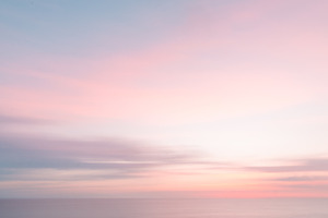 Defocused sunrise sky and ocean containing abstract, artistic, and atlantic