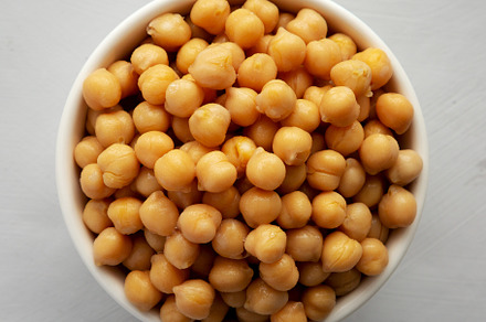 Homemade Preserved Chickpeas in a Bowl, top view., a Food & Drink Photo by LiudmylaChuhunova