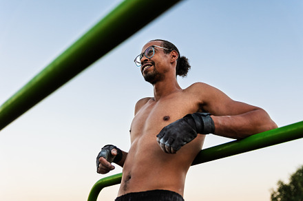 Smiling athlete on an outdoor calist