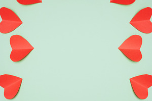 Red paper hearts arranged in a circle, with white space in the c, a Holiday Photo by ndanko