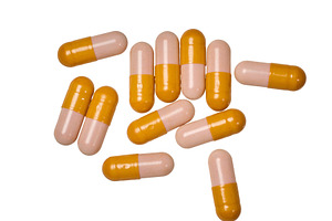 Scattering of medical capsules, two-color shell of yellow and pi, a Health & Medical Photo by ndanko