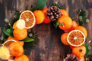 Wreath of fresh ripe tangerines with, a Holiday Photo by Kate S