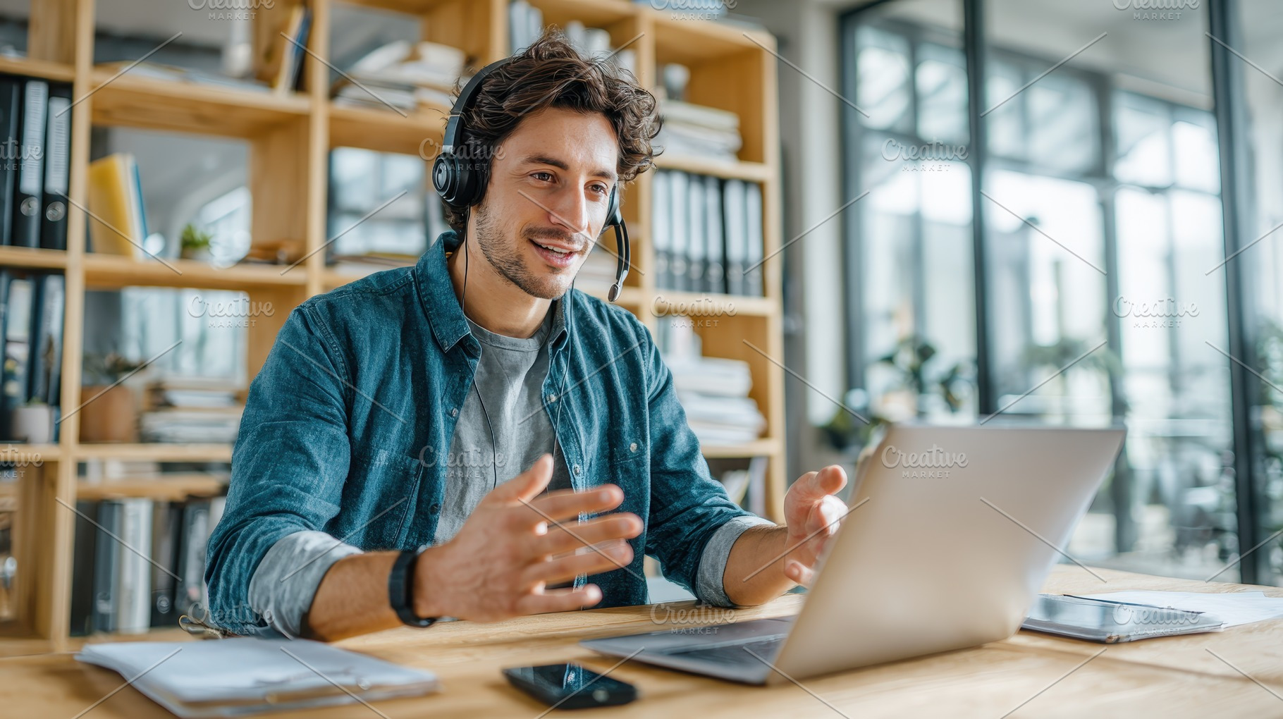 Man using laptop headset video confe, a Photo by Pixeness Studio