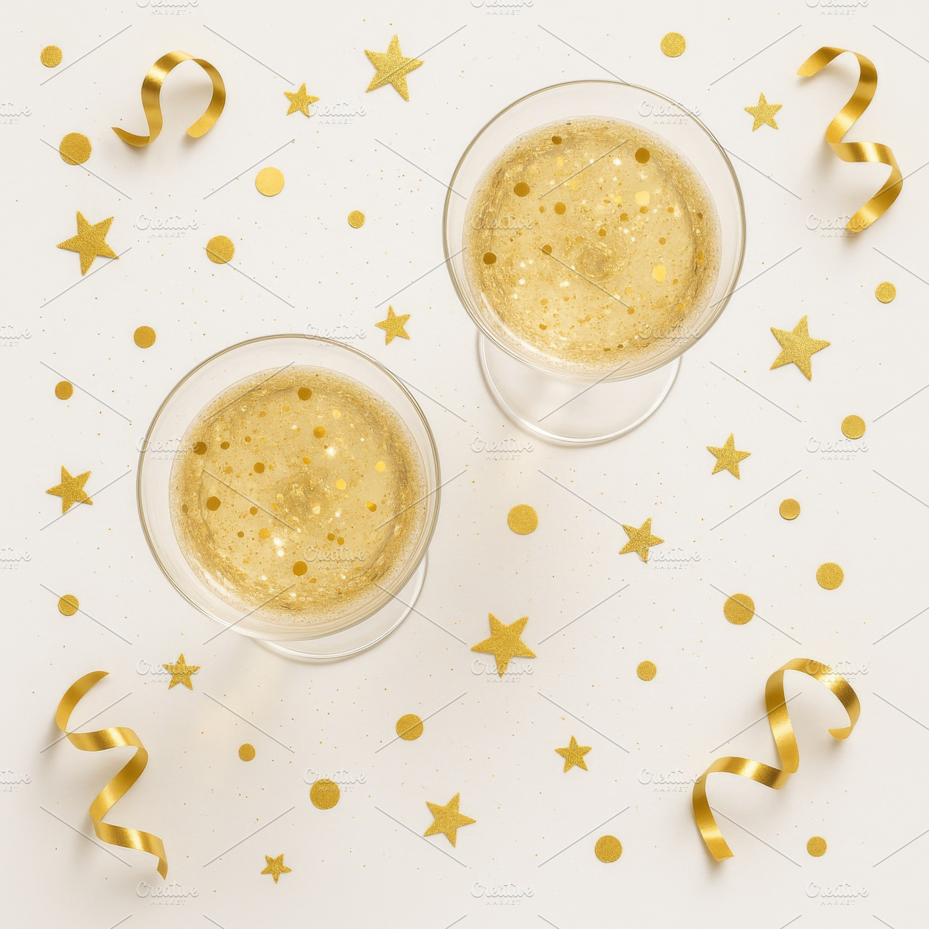 Two glasses champagne and gold decor, a Photo by Dvoevnore photos