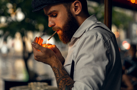 Young bearded man in a cafe, a Person Photo by EVA.studio