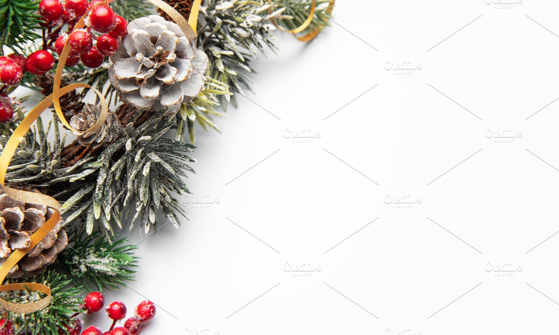 Christmas winter decoration with pinecones and berries creating, a Holiday Photo by Olena Rudo