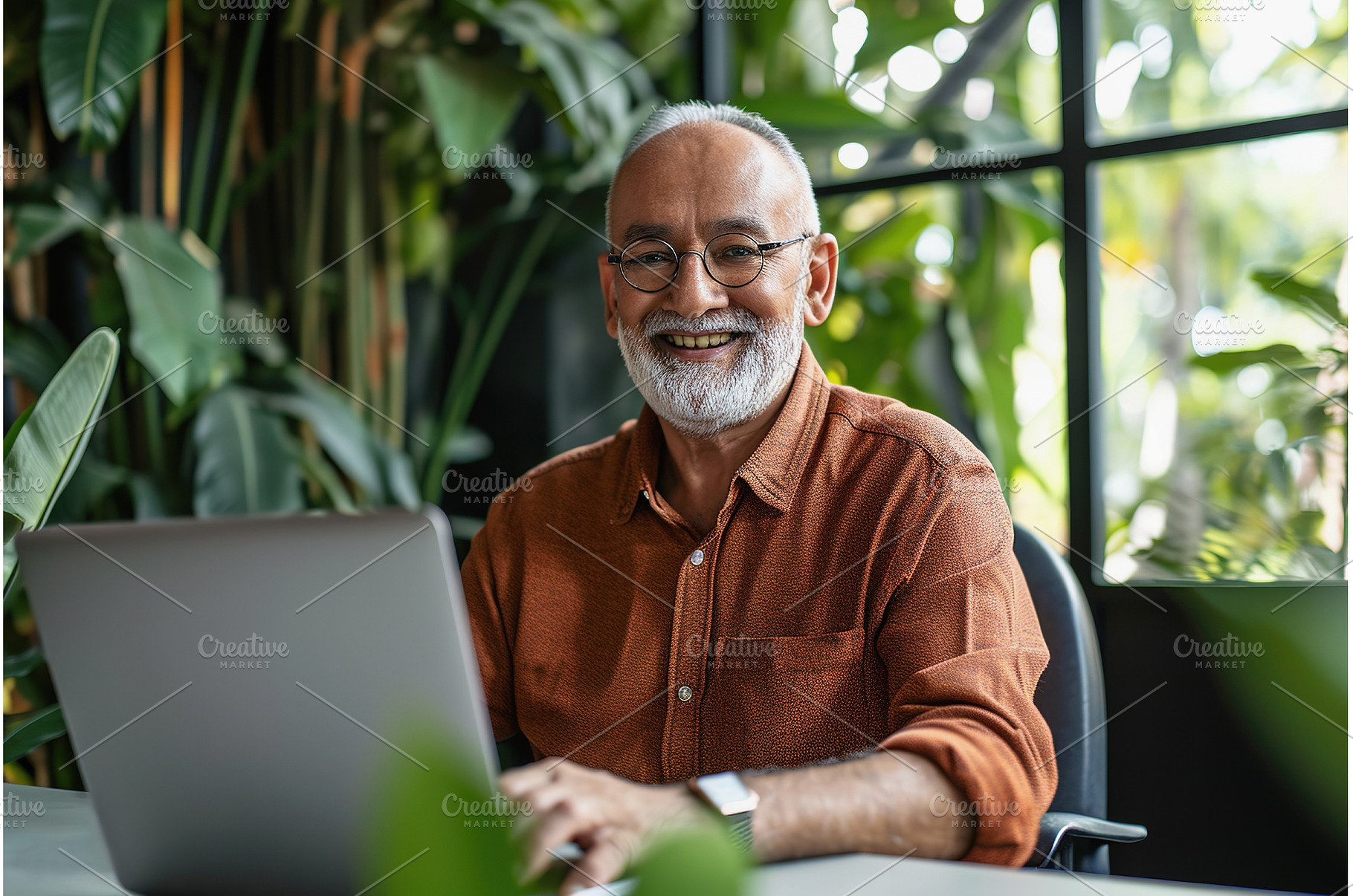 Mature Indian man with laptop at, a Business Photo by Lermont51