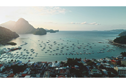 Sunrise at port town with mountain, a Nature Photo by Goinyk