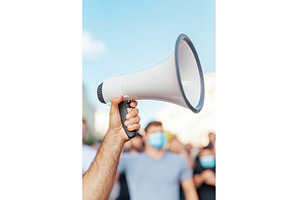 Megaphone Held Up in Front of, an Abstract Photo by Lermont51