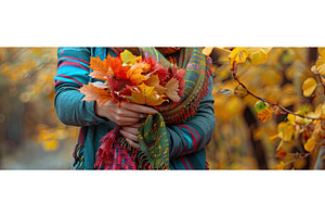 Woman Holds Autumn Leaves In Her