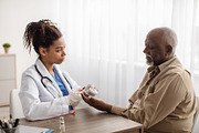 Emergency call system. Doctor giving Alarm Button to Senior Man, a Photo by Prostock-Studio (Thumbnail 2 of 2)