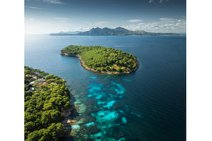 Aerial drone view of a green island, a Nature Photo by den-belitsky