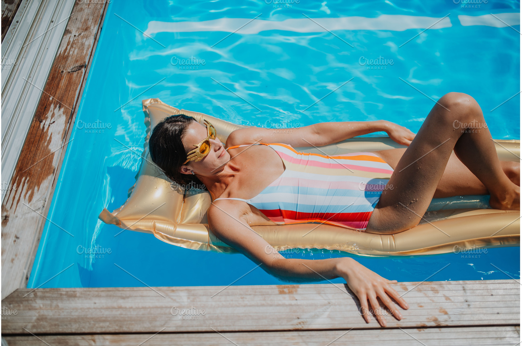 Top view of young woman in swimming, a Person Photo by HalfPoint