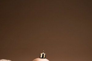 Brown Christmas ornaments creating a festive holiday backdrop with ample copy s, a Photo by Studio ANNA