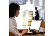 Young pretty woman using laptop in, a Device Mockup by serkum (Thumbnail 1 of 2)