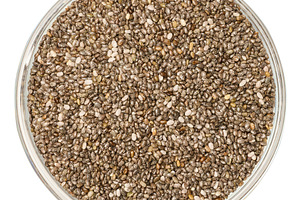 Chia seeds in a glass transparent bowl on an isolated background, a Food & Drink Photo by ndanko