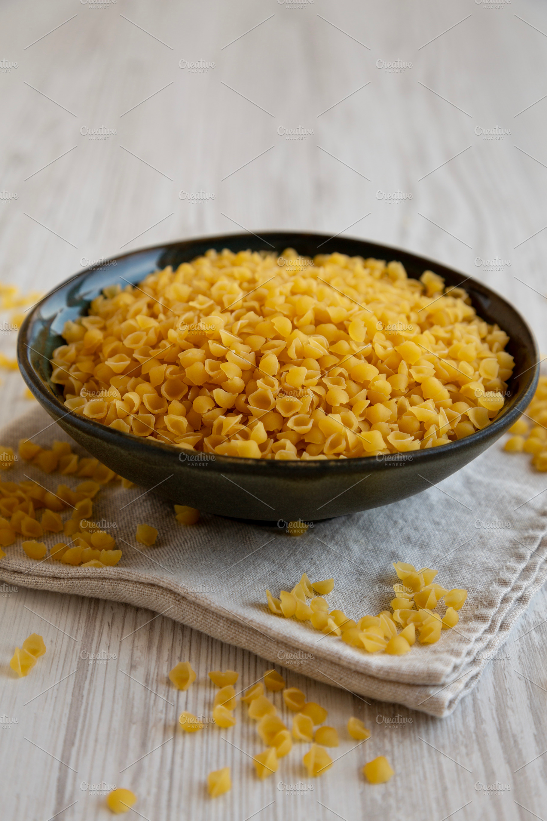 Homemade Perlini Pasta in a Bowl, side view. Close-up., a Food & Drink Photo by LiudmylaChuhunova