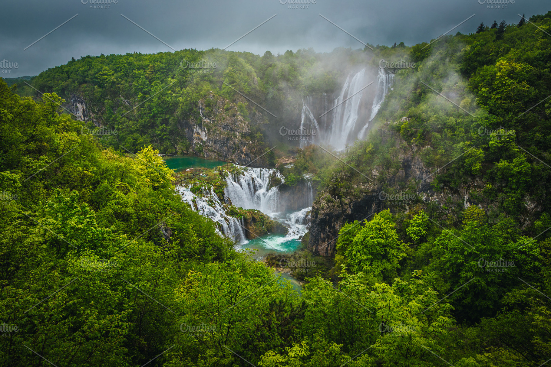 High waterfalls in the green forest, a Nature Photo by Alpine Dreams