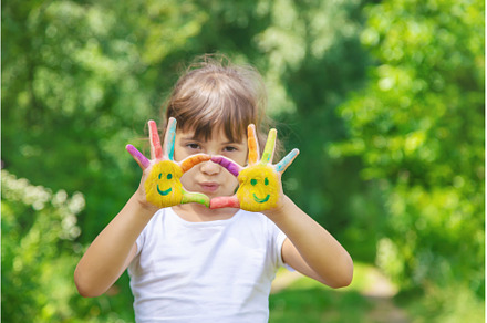 Child hands in paints a smile, an Arts & Entertainment Photo by yanadjana