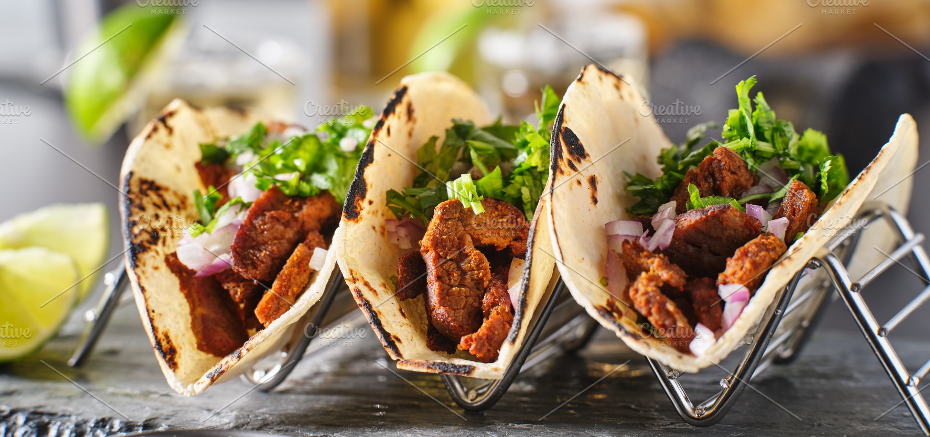 Carne asada tacos in taco holder containing food, tacos, and mexican, a Food & Drink Photo by RezArt