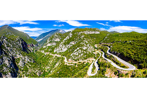 Winding road in the mountains of featuring mountain, road, and landscape, a Transportation Photo by Leonid Andronov