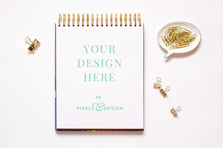 Gold sketchpad mockup containing styled stock photography, sketchpad, and