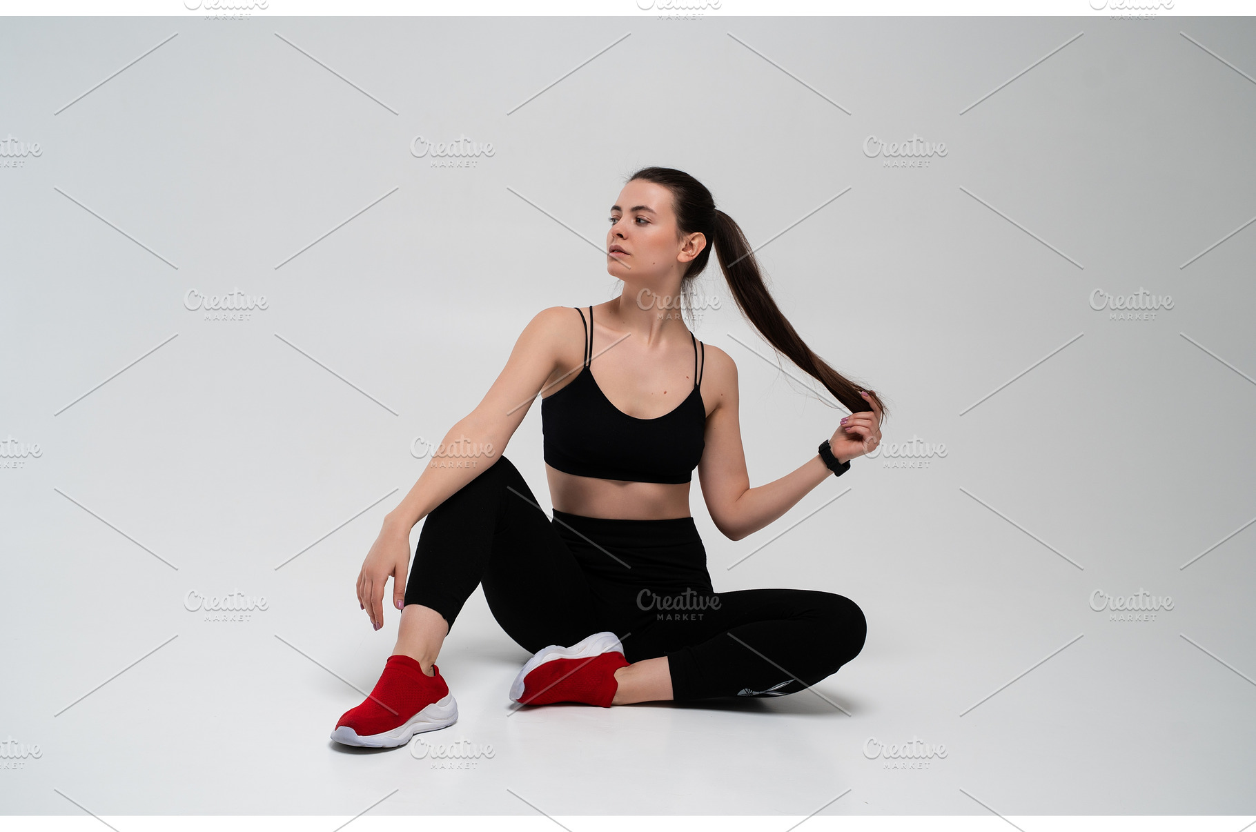 Fitness woman sitting on white, a Sports & Recreation Photo by volodymyrshtun13795