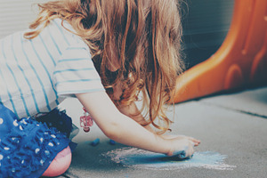 Little Girl Coloring with Chalk