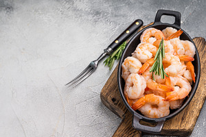 A plate of shrimp is on a wooden cutting board with a fork and a, a Food & Drink Photo by composter-box@mail.ru