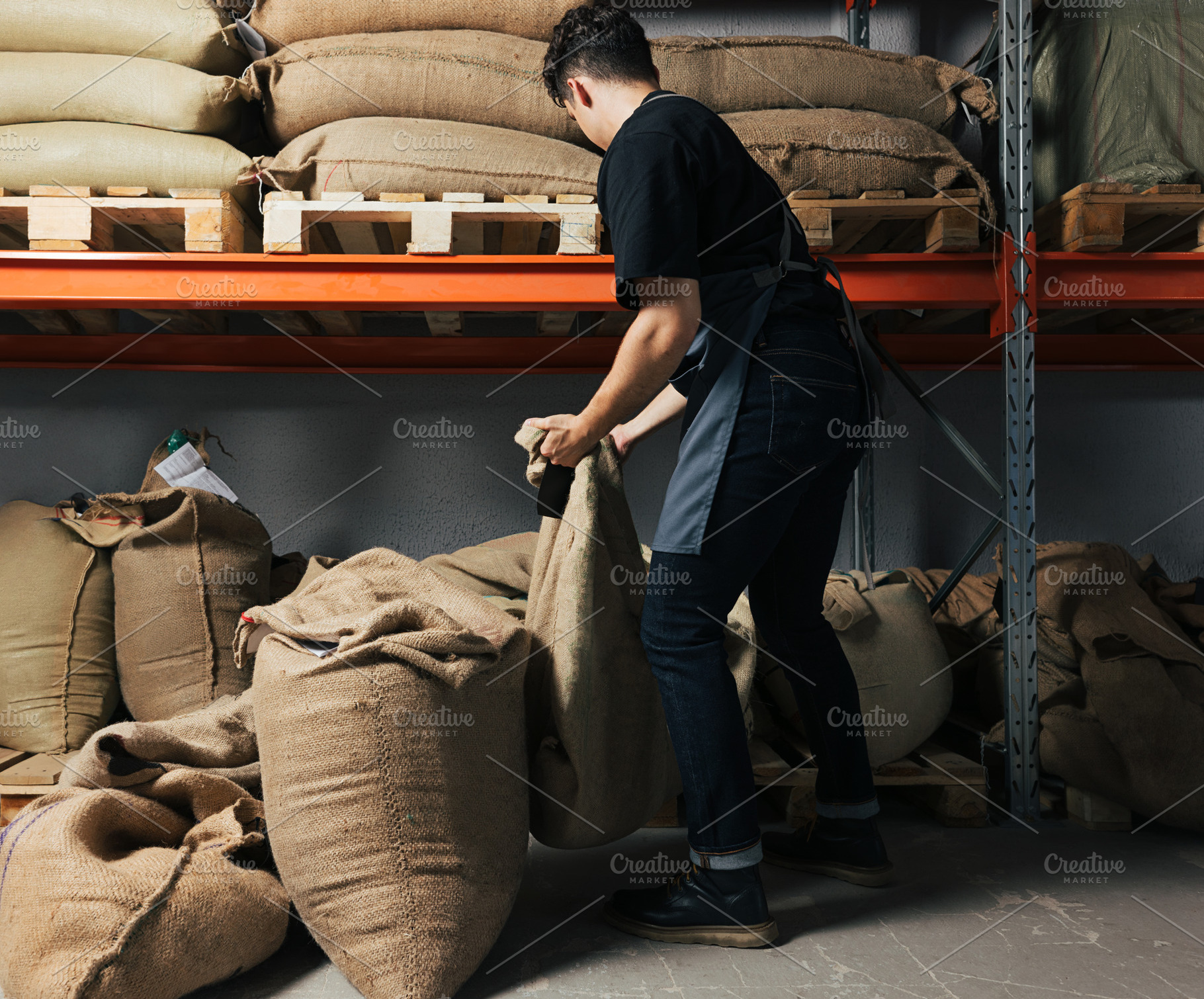 Back view of a young warehouse worke, a Person Photo by Artem Varnitsin