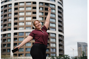 Body positive woman warming up, a Sports & Recreation Photo by HalfPoint