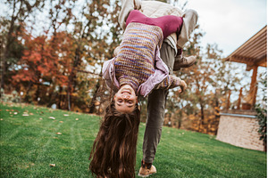 Father playing with daughter, a Person Photo by HalfPoint