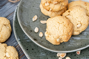 Baked cookies tasty food served peanut table plate, a Food & Drink Photo by Photo Drive Studio