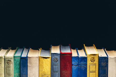 Old books in a row in library on bla containing ancient, antique, and archive, a School & Education Photo by Tinyakov Story