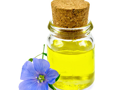 Oil linenseed in jar isolated, a Food & Drink Photo by rezkrr